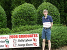 Neighborhood Sign: Standing with the sign at the front of our neighborhood.