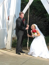 Ringing  the Bell: Holly and Adam ringing the bell immediately after wedding